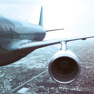 Commercial jet in the sky, close up of wing.